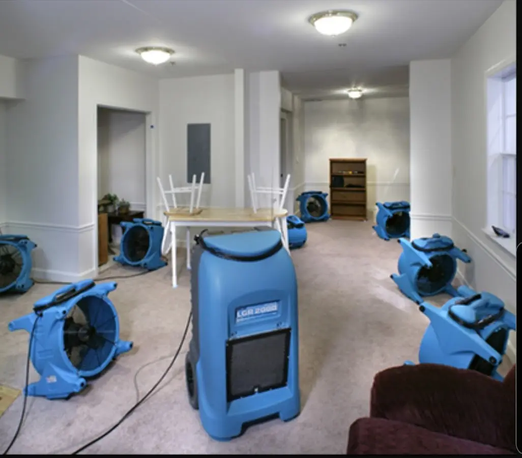 Air movers and dehumidifier setup for Water Damage Restoration in Venus